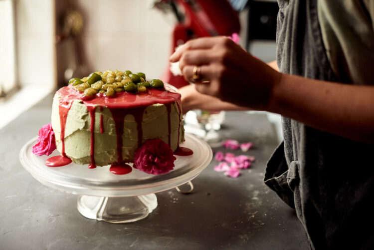 Decorating the raspberry and matcha boba lava cake